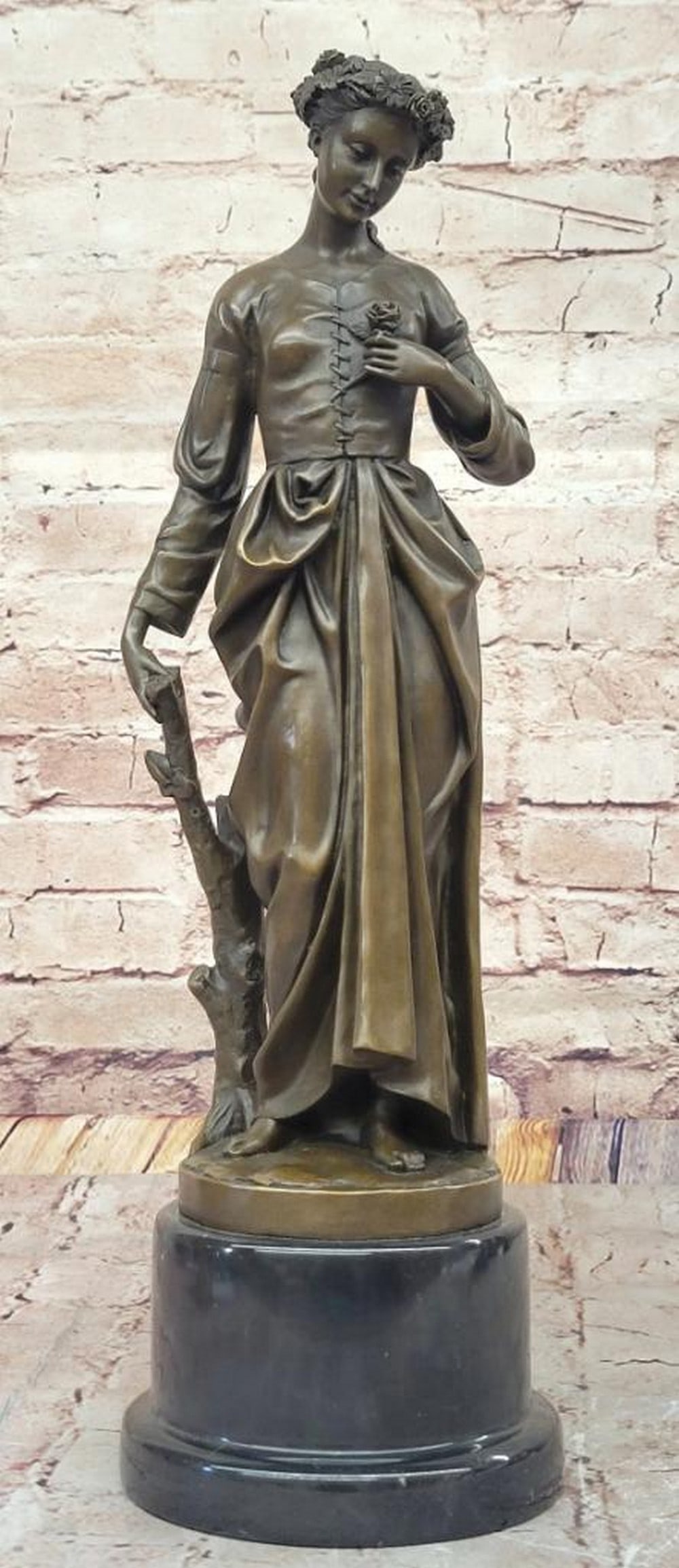 Tranquil Maiden Bronze Sculpture Inspired by Zegut/Tusey - 17'' x 7'': Tranquil Maiden Bronze Sculpture Inspired by Zegut/Tusey - 17" x 7" This exquisite bronze sculpture by Zegut/Tusey captures a young maiden in a moment of quiet reflection. Leaning gracefully a