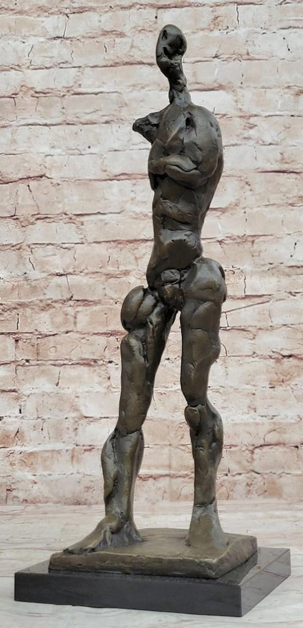 Abstract Inspired Bronze or a Tall Man - 16.5'' x 6'': Abstract Inspired Bronze or a Tall Man - 16.5" x 6" This captivating abstract sculpture presents a unique interpretation that sparks conversation and intrigue. The figure of a man challenges t