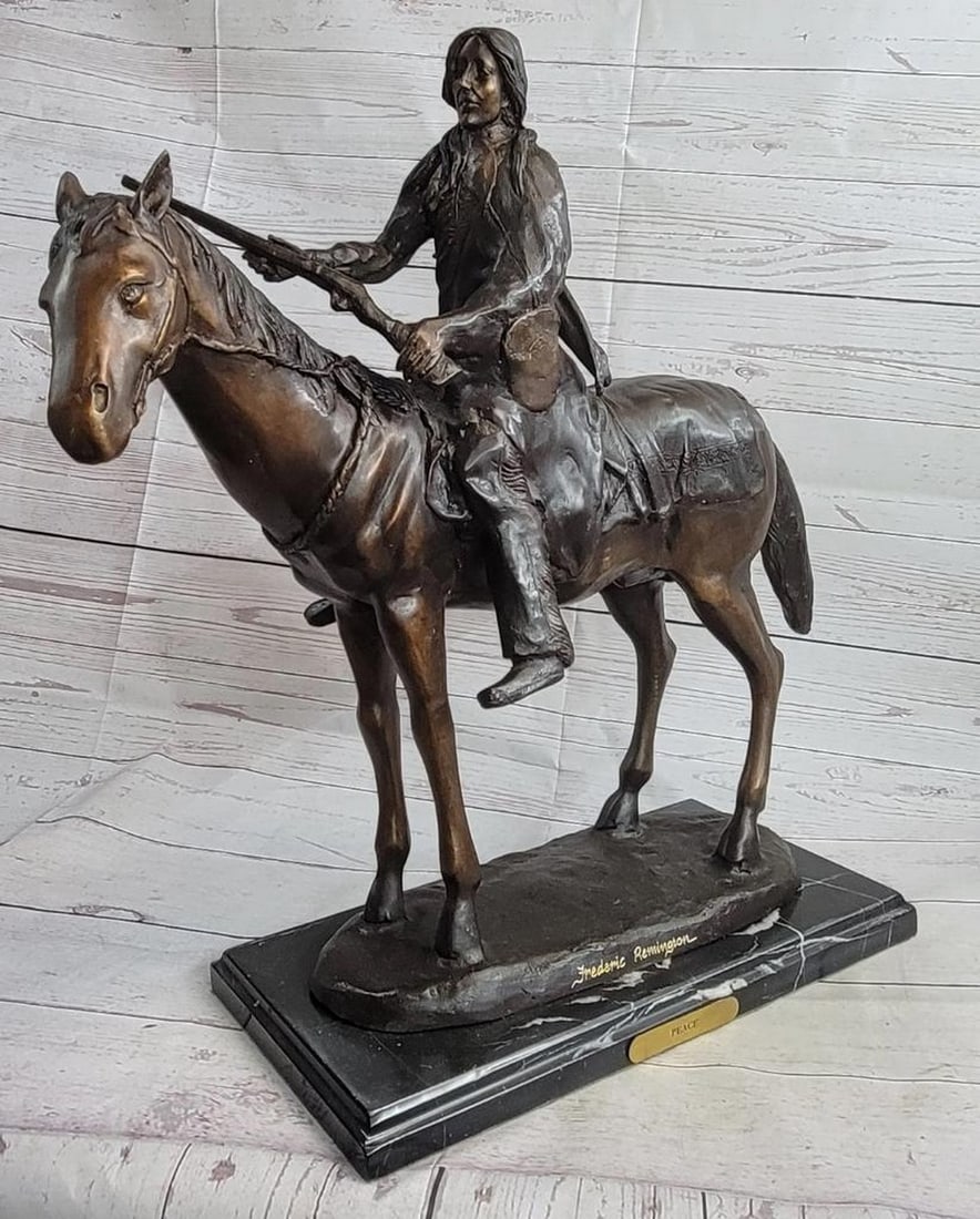 James Fraser PEACE Native American Indian on Horseback Bronze Sculpture Western: This is a particularly detailed sculpture of a Native American man on his horse. The horse is young but strong and stands calmly as the rider cocks his riffle, the reigns hanging loosely around his ne