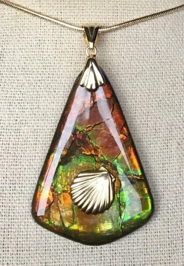 Prismatic Relic Ammolite Pendant: Prismatic Relic Ammolite Pendant This is a nice Ammolite pendant with a gem in autumn colors and a shell accent. This gem has a great stained glass pattern in red, green, orange and gold. The shell