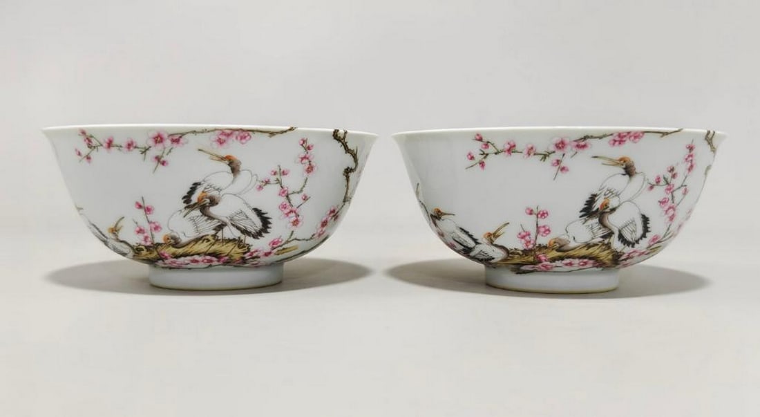 Famille Rose Six Cranes Pattern Bowls: Famille Rose Six Cranes Pattern Bowls A pair of exquisite bowls, featuring a refined Famille Rose design with plum blossoms and six cranes. The vibrant floral motifs, paired with the graceful cranes, 
