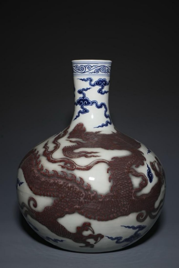 Inspired Ming Dynasty Gall Bottle With Dragon Pattern: Inspired Ming Dynasty Gall Bottle With Dragon Pattern. This inspired gall bottle reflects the grandeur and imperial symbolism of Ming Dynasty porcelain, featuring a majestic dragon motif in blue and w