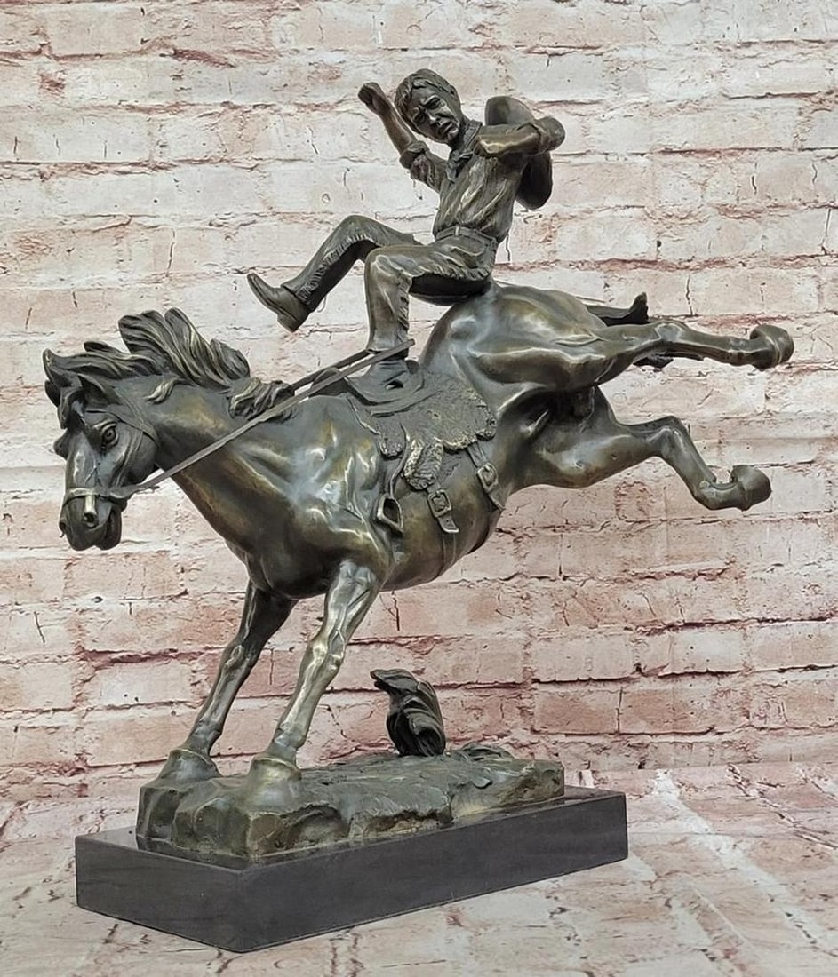 Western Bucking Bronco and Cowboy Bronze Sculpture - 20'' x 20'': Western Bucking Bronco and Cowboy Bronze Sculpture - 20" x 20" This original limited edition bronze sculpture by T. Baker vividly captures the rugged spirit of the American West, portraying a 