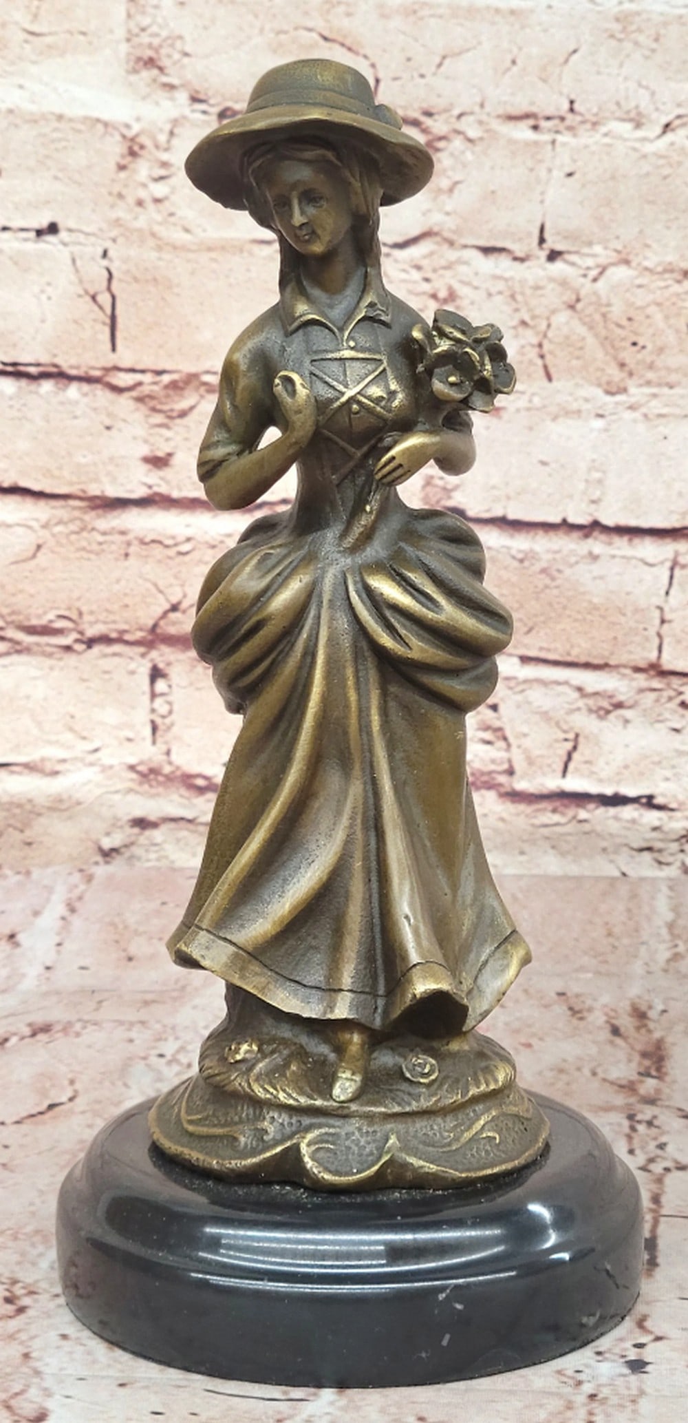 Victorian Lady Holding Flowers Original Bronze Statue - 10.5'' x 4.5'': Victorian Lady Holding Flowers Original Bronze Statue - 10.5" x 4.5" Milo's Victorian Woman Bronze Sculpture embodies the grace and refinement of the era. Poised in a flowing gown, she