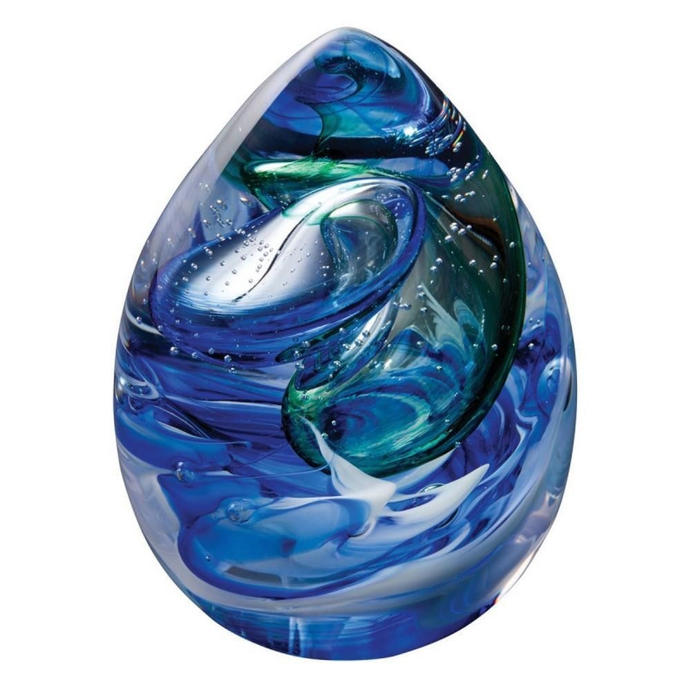 Ocean Tempest Paperweight: Ocean Tempest Paperweight A handcrafted glass paperweight capturing the motion of turbulent ocean waves. Swirls of blue and tiny bubbles create a sense of depth and movement, evoking the hidden