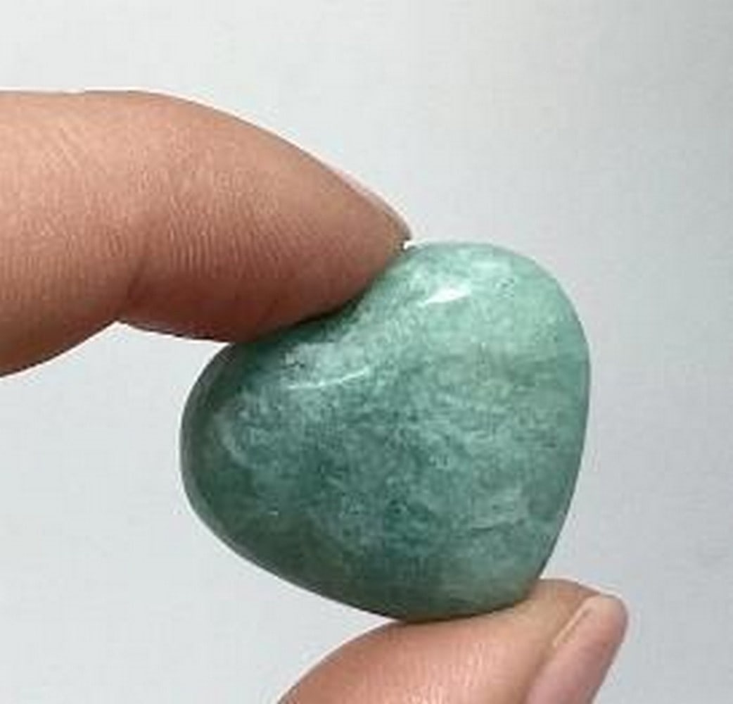 Tranquil Spirit Amazonite Heart: Tranquil Spirit Amazonite Heart Amazonite is a beautiful blue-green gemstone that often reminds people of the colors of our Canadian Rocky Mountain lakes or of tropical oceans. It is found in both mas