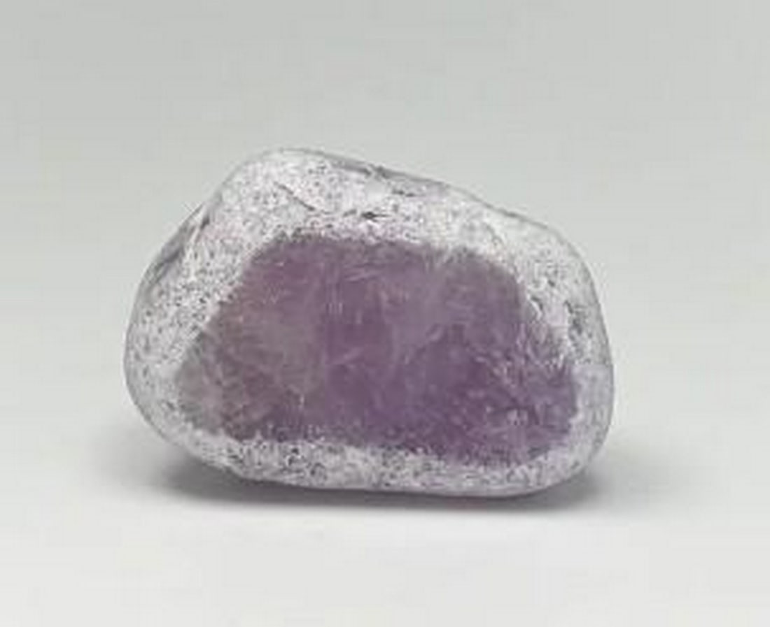 Purple Serenity Amethyst Egg: Purple Serenity Amethyst Egg Ema Eggs, also recognized as 'Dragons Eggs,' 'Window Pebbles,' or 'Seer Stones,' originate from the Ema River in southern Brazil. These stones undergo a natural tumbling p