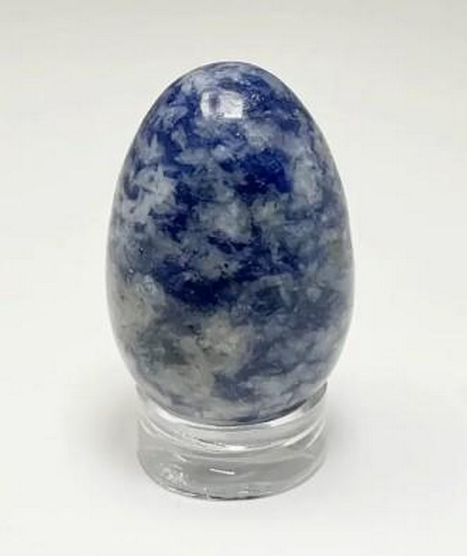 Luminous Blue Sodalite Mini Egg: Luminous Blue Sodalite Mini Egg Radiating with deep blue tones, the Luminous Blue Sodalite Mini Egg showcases the natural beauty and serene glow of Sodalite. Its rich colour and subtle white streaks e