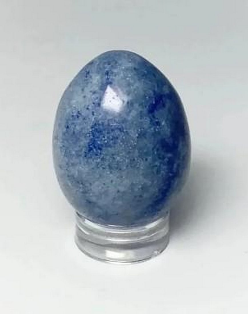 Celestial Blue Aventurine Egg: Celestial Blue Aventurine Egg Shimmering with celestial charm, this blue aventurine egg captivates with its deep, star-speckled hue. The stone's natural inclusions create a soft, ethereal glow,