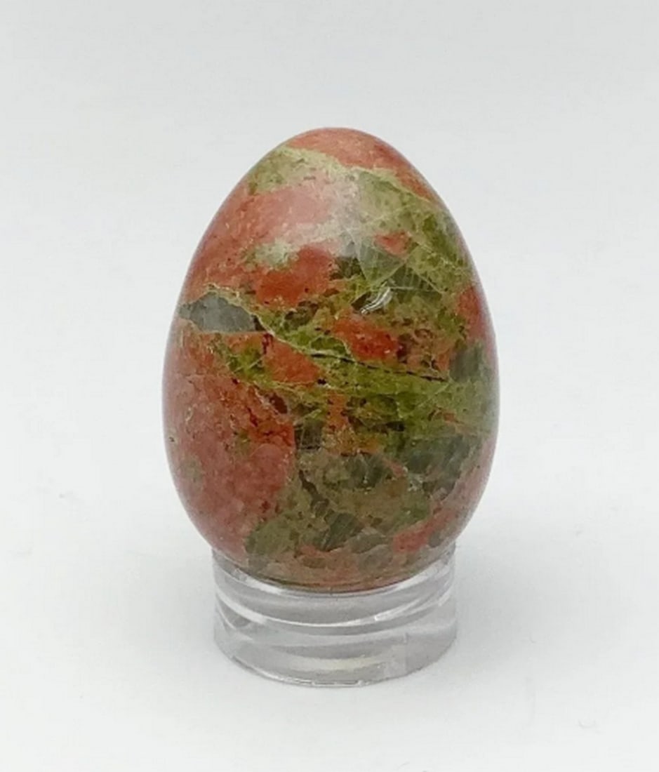 Unakite Serenity Mini Egg: Unakite Serenity Mini Egg Grounding and serenc, the Unakite Serenity Egg radiates harmony with its blend of lush green and warm russet hues. This polished stone symbolizes balance, renewal, and emotio