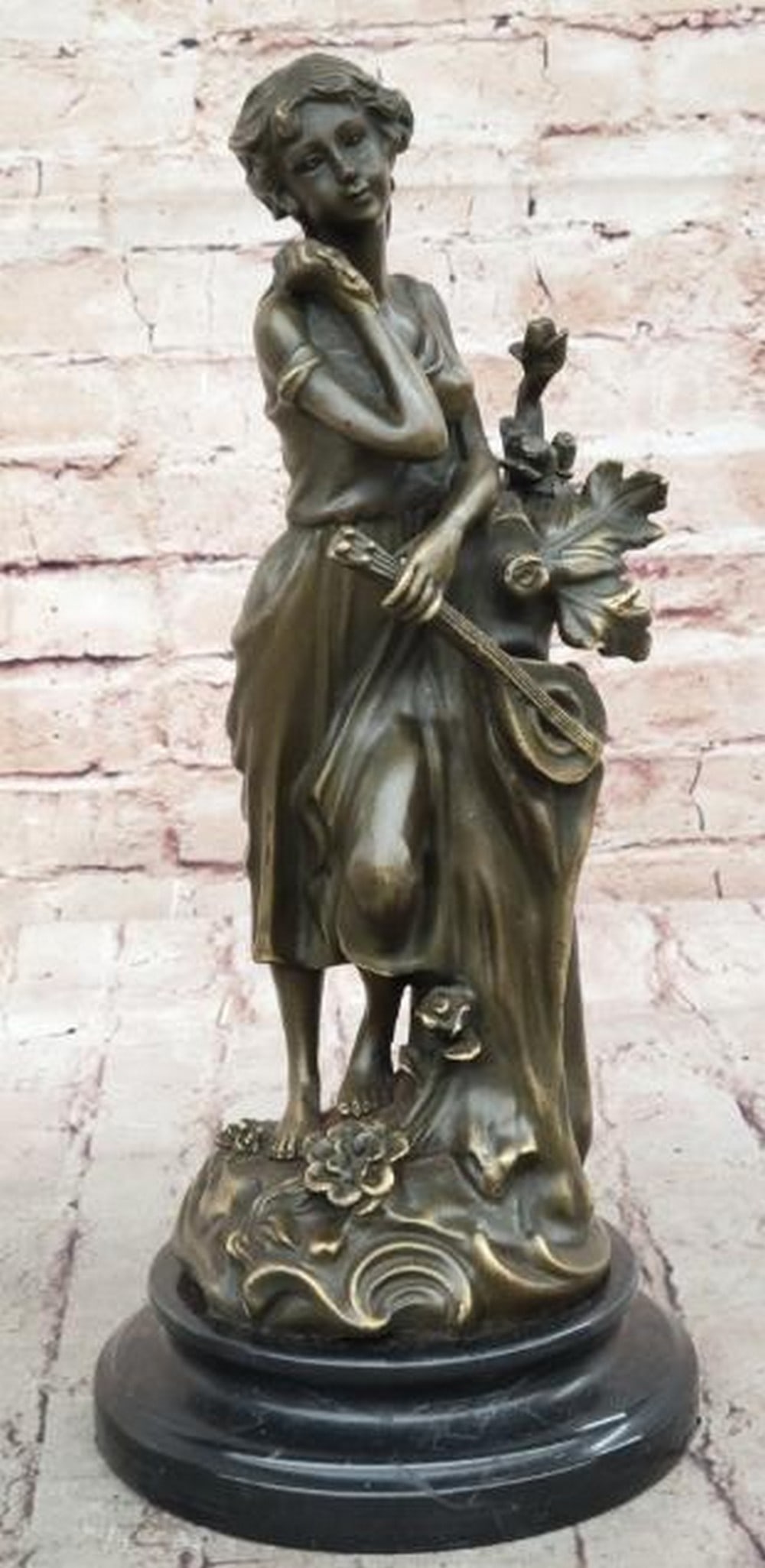 Melody of the Earth Bronze Sculpture - 13'' x 6'': Melody of the Earth Bronze Sculpture - 13" x 6". Inspired by and bearing the signature of talented Portuguese artist Miguel Lopez, known as Milo, this elegant bronze sculpture captures the ser