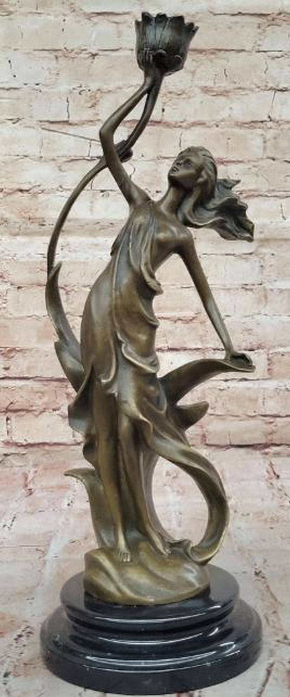 Blooming Light Bronze Sculpture - 16.5'' x 7'': Blooming Light Bronze Sculpture - 16.5" x 7". Inspired by and bearing the signature of artist J. Kassin, this captivating bronze sculpture beautifully intertwines nature and illumination. A gr