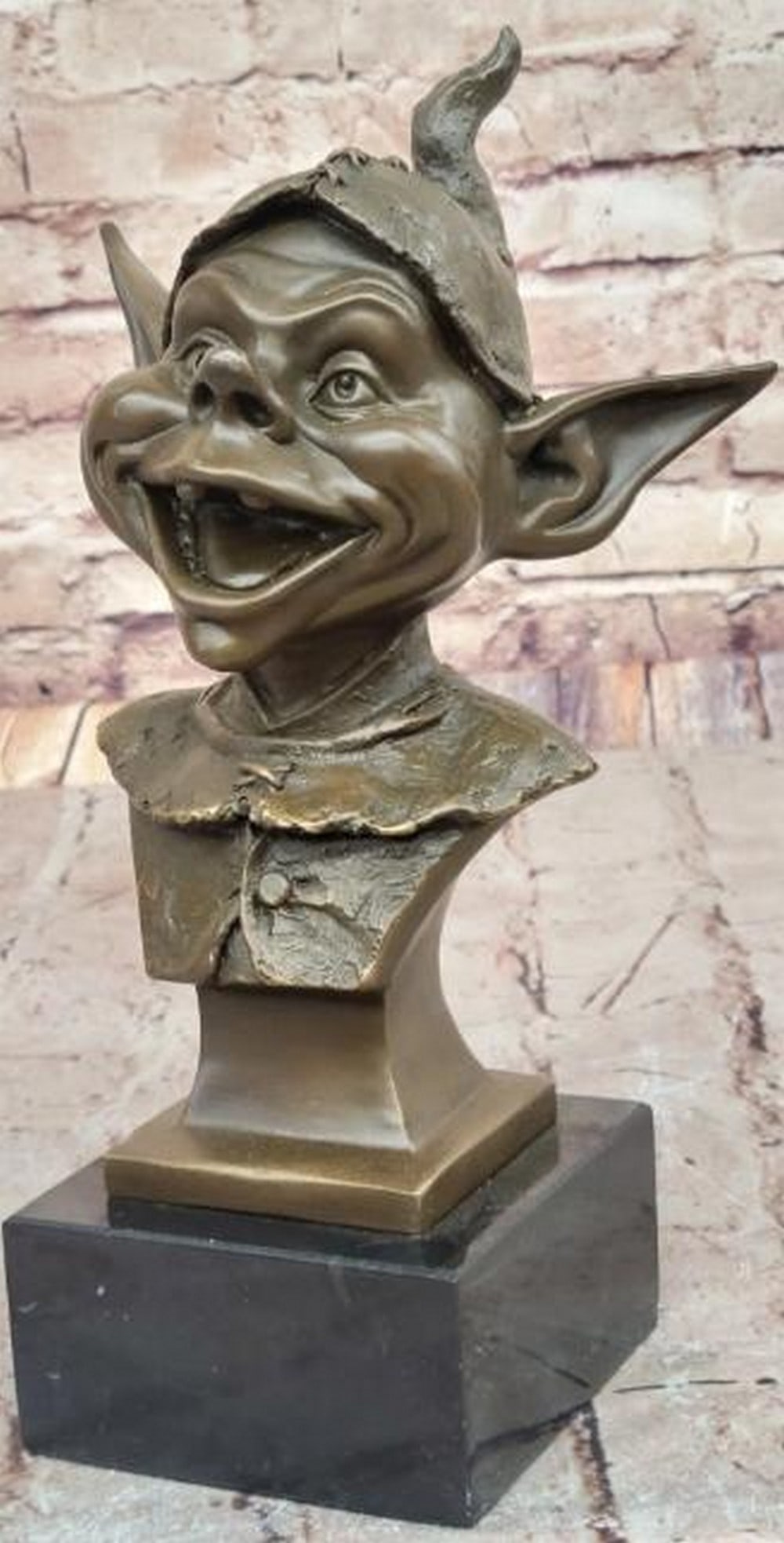 Mischief's Grin Bronze Sculpture - 11'' x 7'': Mischief's Grin Bronze Sculpture - 11" x 7" This whimsical bronze sculpture bearing the signature of artist Juno, captures the playful and mischievous essence of a goblin, his face alight with