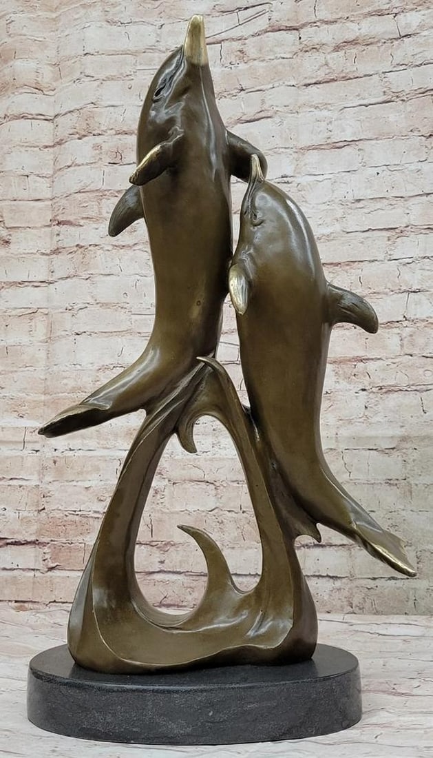 Signed Original Dolphins Leaping From Ocean Bronze Sculpture - 21'' x 12'': Signed Original Dolphins Leaping From Ocean Bronze Sculpture - 21" x 12" Create a mesmerizing focal point in your landscape or hardscape design with the captivating "2 Dolphins Swimming