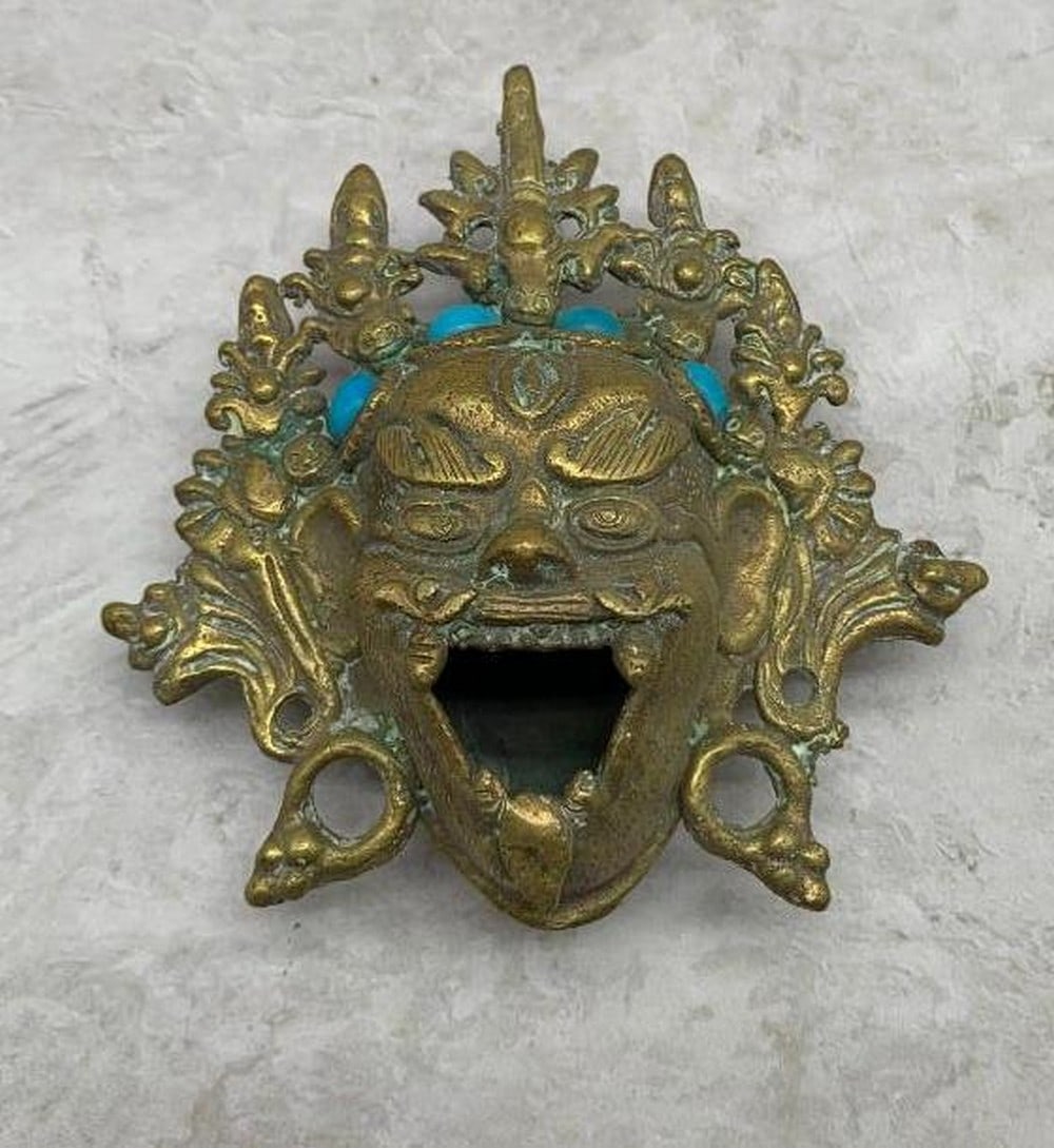 Spirit Incense Burner: Cast Metal Face with Blue Inlays: Spirit Incense Burner: Cast Metal Face with Blue Inlays This striking antique incense burner features a detailed cast metal figure of a face with an open mouth, exuding a regal yet mysterious