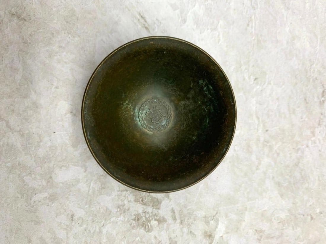 Elephant Bronze Dish: Elephant Bronze Dish This charming small bronze bowl, likely crafted for holding jewelry or trinkets, is a testament to both artistry and symbolism. The sides of the bowl are adorned with finely detai