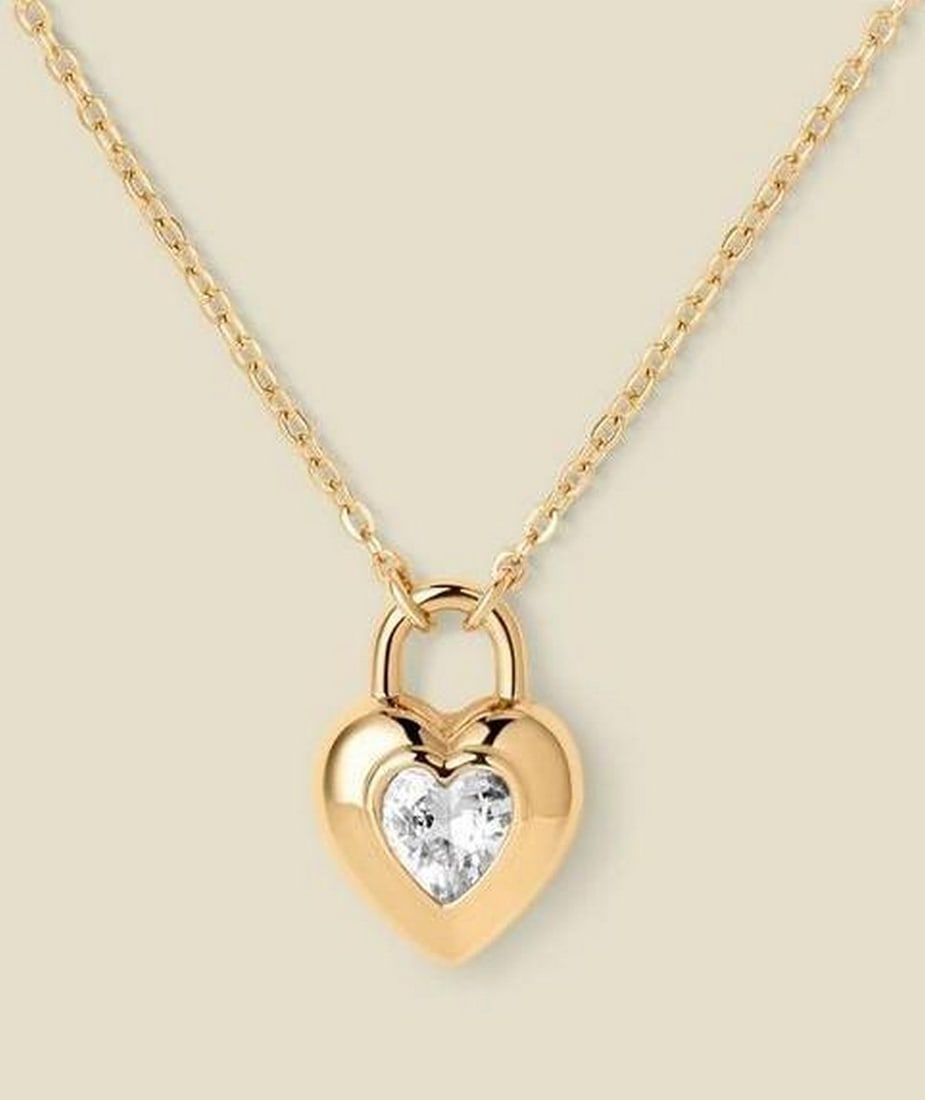 Gold CZ Heart Padlock Necklace: Gold CZ Heart Padlock Necklace Shaped like a tiny heart-locked secret, this padlock necklace features a CZ accent that adds gentle sparkle, symbolizing love that feels steady, safe, and enduring.