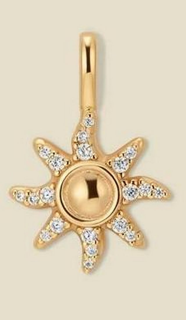 Gold Vermeil Sunburst CZ Charm: Gold Vermeil Sunburst CZ Charm The Sunburst Charm features radiating rays accented with prong-set cubic zirconia, creating a sparkling, luminous effect. Crafted in gold vermeil, it symbolizes energy,