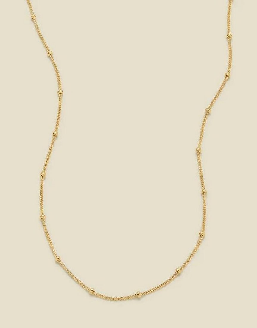 Starlit Satellite Chain: Starlit Satellite Chain Delicate and luminous, this timeless chain adds a subtle shimmer to every moment. Lightweight yet eye-catching, its evenly spaced accents create a celestial glow, perfect for l