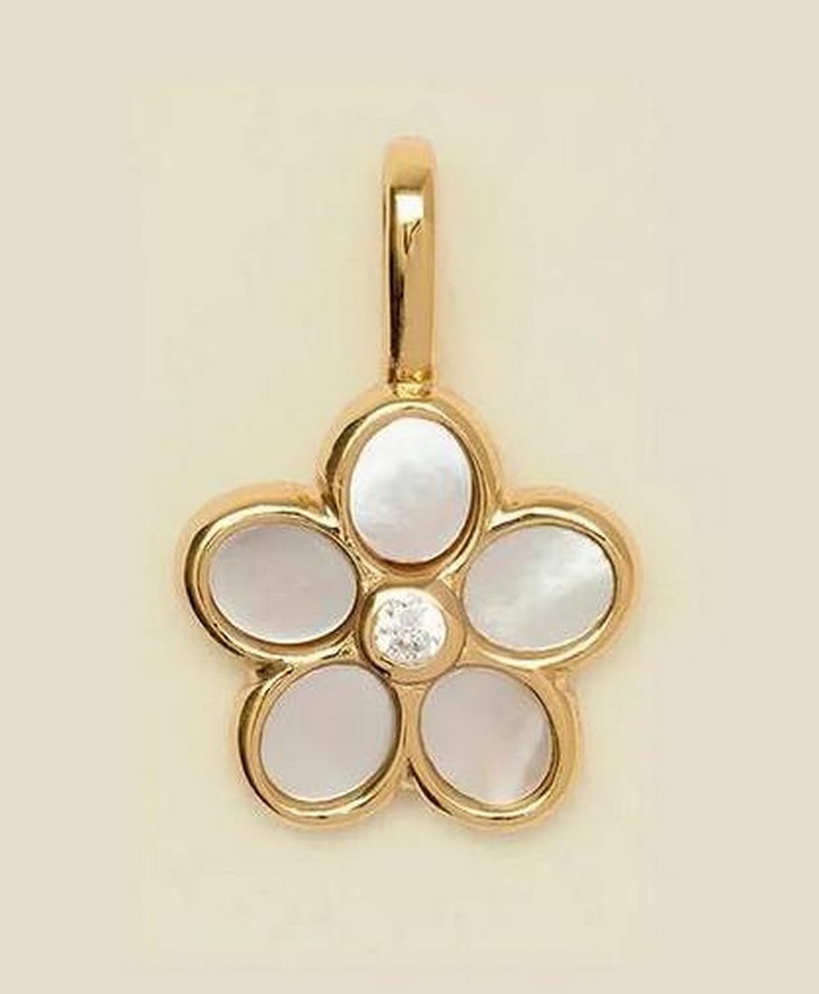 Vermeil Gold Lilly Pendant with Quartz Petals & Cz Center Stone: Vermeil Gold Lilly Pendant with Quartz Petals &; Cz Center Stone Embrace your wild, free-spirited side with this dreamy daisy charm. Featuring quartz petals and a CZ center, it adds a touch of charm