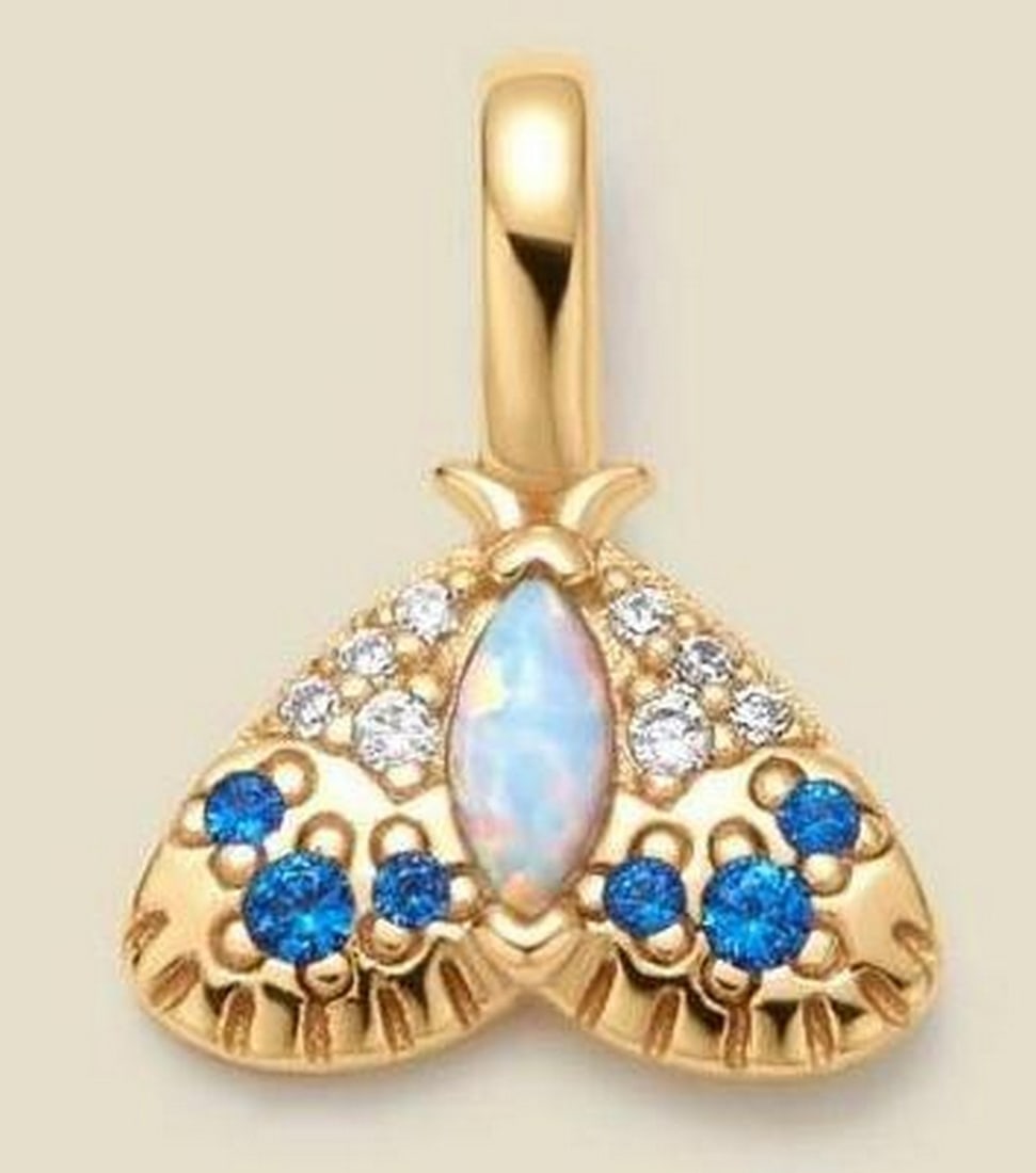 Seeker of Light Opal Moth Charm: Seeker of Light Opal Moth Charm Inspired by the moth's unwavering pursuit of light, this charm symbolizes courage and the journey toward your true path. Featuring a radiant opal and tiny CZs, it