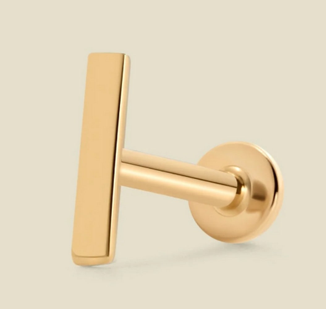 14k Solid Gold Bar Stud Earring: 14k Solid Gold Bar Stud Earring With a flawlessly polished finish, these bar earrings add a subtle pop of shine. Each petite, solid gold earring features a smooth, flat back that slides through your