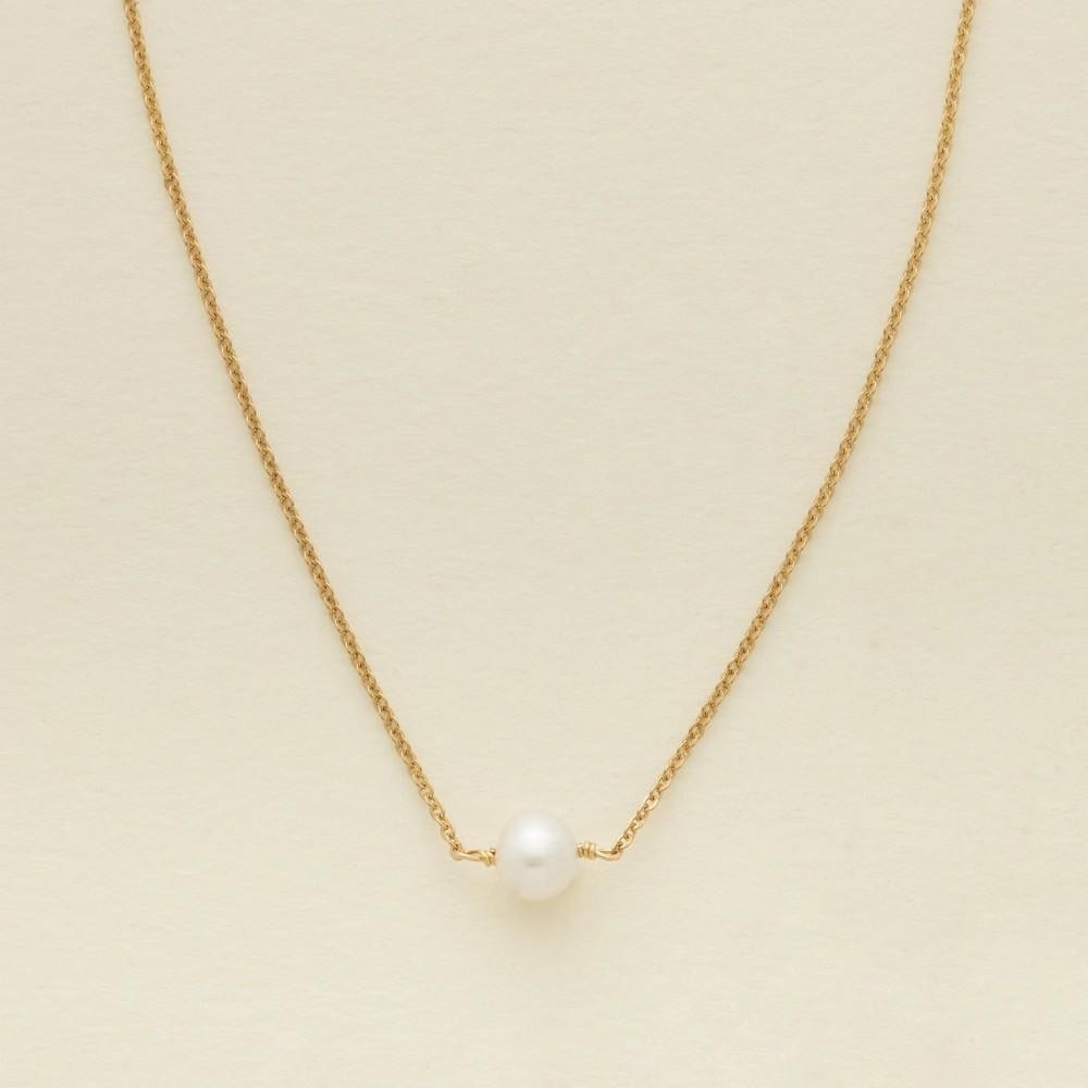 Solstice Pearl Choker: Solstice Pearl Choker Graceful and refined, this delicate choker features a single luminous pearl on a fine gold chain - a symbol of strength, resilience, and beauty. Effortlessly elegant, it's a