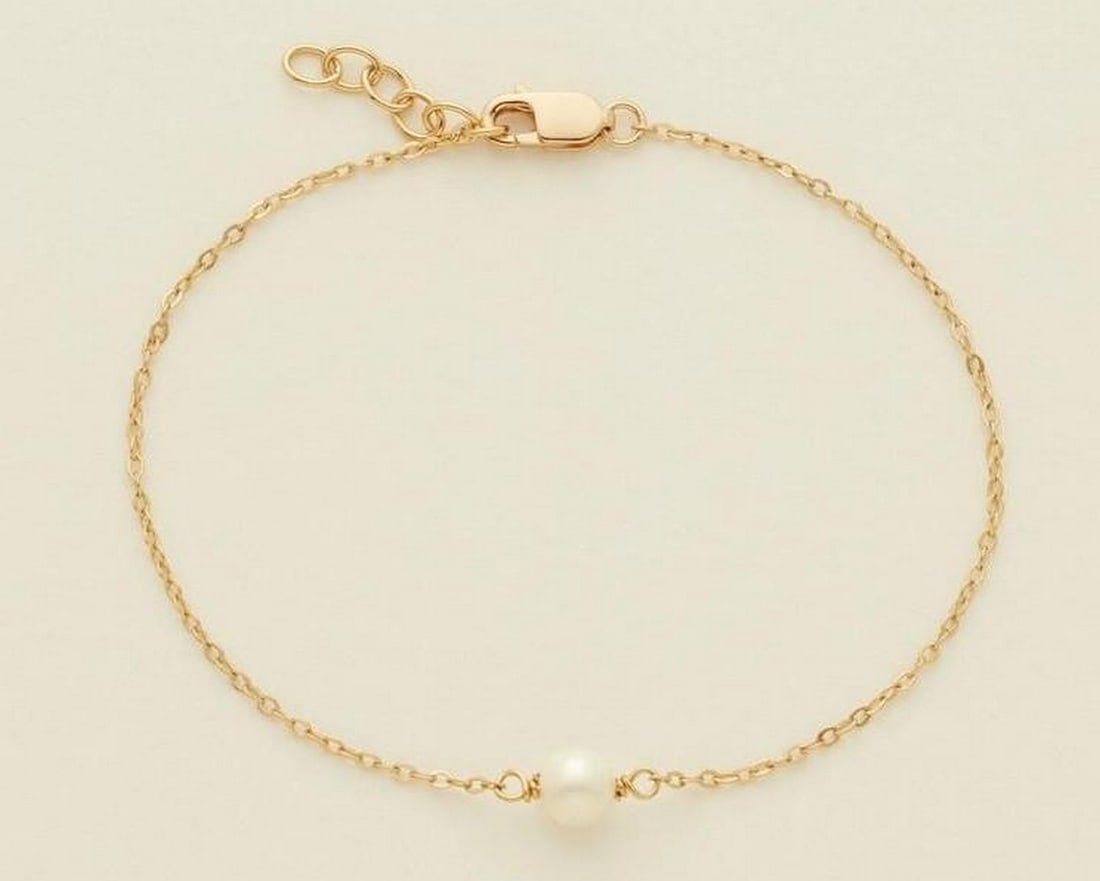 Ocean Treasure Pearl Bracelet: Ocean Treasure Pearl Bracelet A symbol of resilience and beauty, this delicate gold bracelet features a luminous pearl - nature's hidden gem, formed in the depths of the sea. A reminder that even