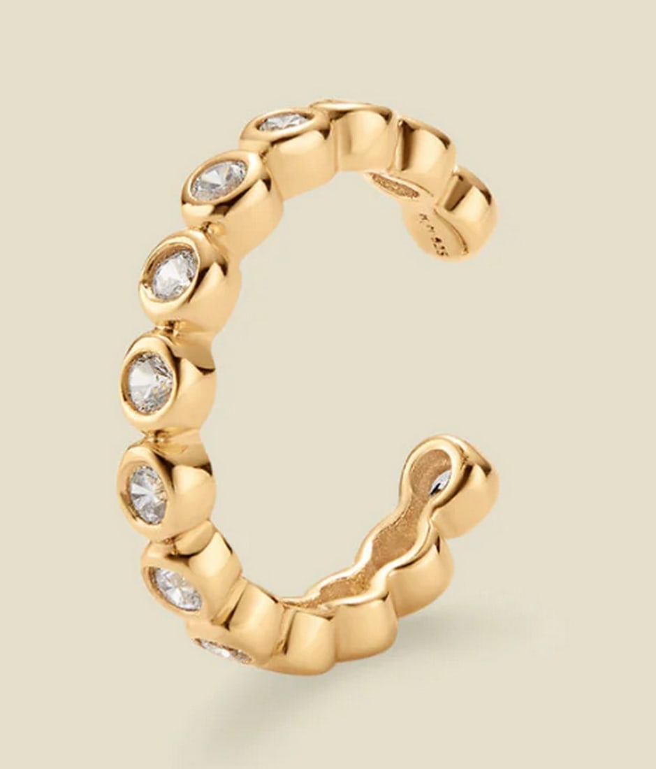 Gold Vermeil & CZ Poppy Ear Cuff Earrings: Gold Vermeil &; CZ Poppy Ear Cuff Earrings Whether worn solo or stacked, the CZ Poppy Ear Cuff adds a touch of freshly picked perfection to your look. A row of our signature sparkling dots catches
