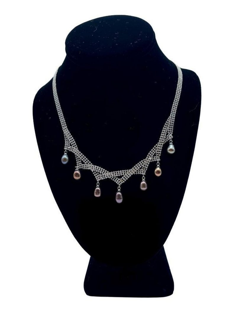 Metal Bead Necklace with Dark Purple-Pink Hanging Pearls: Metal Bead Necklace with Dark Purple-Pink Hanging Pearls This elegant necklace features a strand of polished metal beads accented by seven lustrous hanging pearls in a striking dark purple-pink hue.
