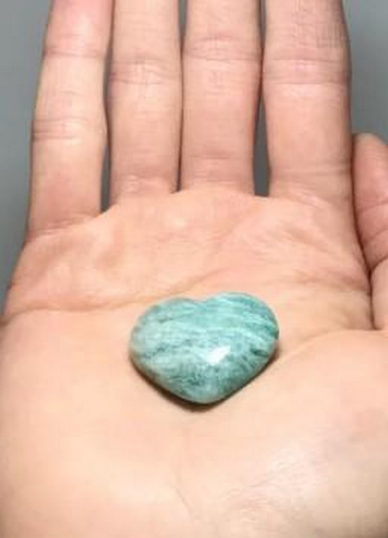 Amazonite Love Heart: Amazonite Love Heart Amazonite is a beautiful blue-green gemstone that often reminds people of the colors of our Canadian Rocky Mountain lakes or of tropical oceans. It is found in both massive and cr