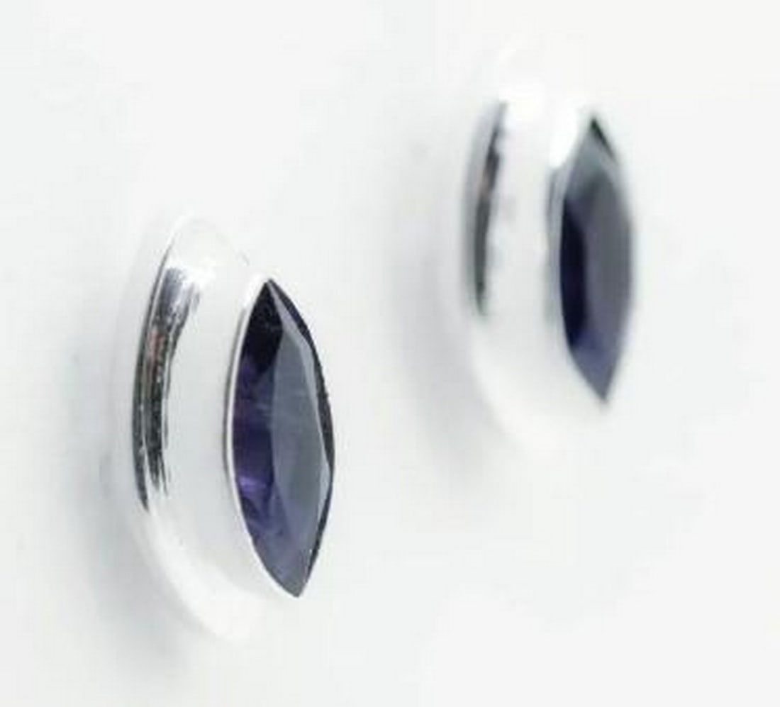 Elegant Iolite Stud Earrings: Elegant Iolite Stud Earrings Iolite is a beautiful purple-blue gemstone. It gets its name from the Greek 'Ios' meaning violet. It is believed that the Vikings used iolite to filter and shade glare