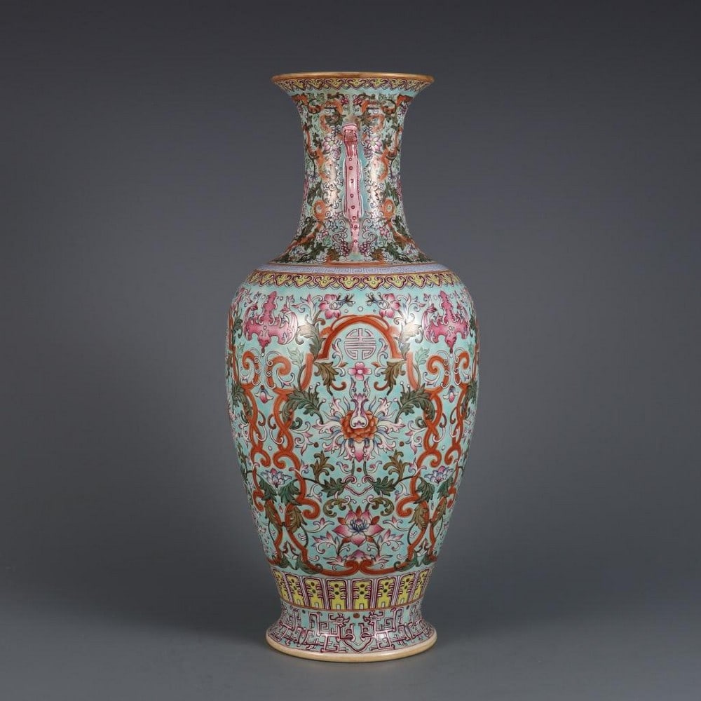 Green-Ground Famille Rose Fushou Double-Eared Bottle: Green-Ground Famille Rose Fushou Double-Eared Bottle A superb porcelain bottle featuring a green ground and adorned in vibrant famille rose enamels. The body is decorated with the auspicious Fushou