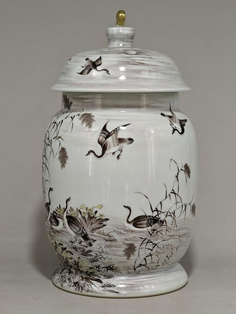 Grisaille Jar with Lid And Wild Geese in River Landscape: Grisaille Jar with Lid And Wild Geese in River Landscape This elegant lidded jar showcases a masterful grisaille painting of wild geese in a dynamic natural setting. Rendered in delicate shades of gra