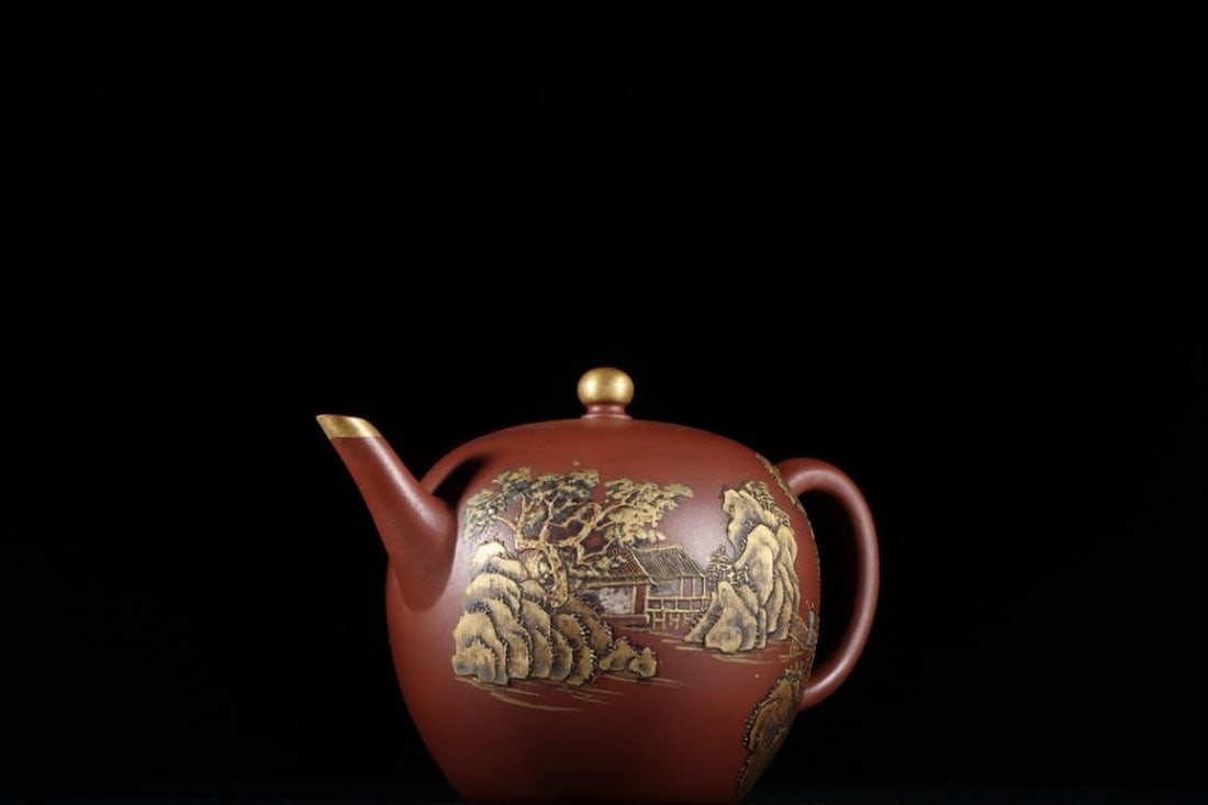 Landscape Zisha Teapot: Landscape Zisha Teapot This stunning Zisha teapot showcases a beautifully carved landscape scene depicting traditional Chinese houses nestled among the mountains, surrounded by lush trees. The