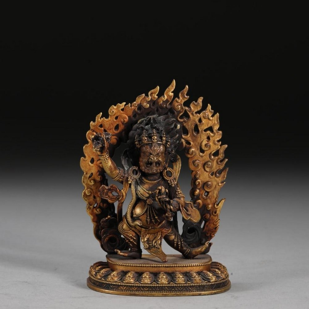 Cast Gilt Bronze Mahakala Statue: Cast Gilt Bronze Mahakala Statue This finely cast gilt bronze statue depicts Mahakala, the fierce protective deity, crafted with exceptional precision inspired by the Ming Dynasty. The statue features