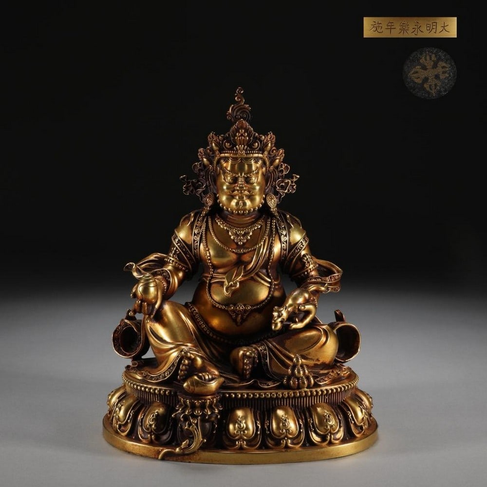Cast Gilt Bronze God of Wealth Statue: Cast Gilt Bronze God of Wealth Statue This finely cast gilt bronze statue inspired by the Ming Dynasty depicts the Yellow God of Wealth seated in majestic repose, radiating authority and prosperity.