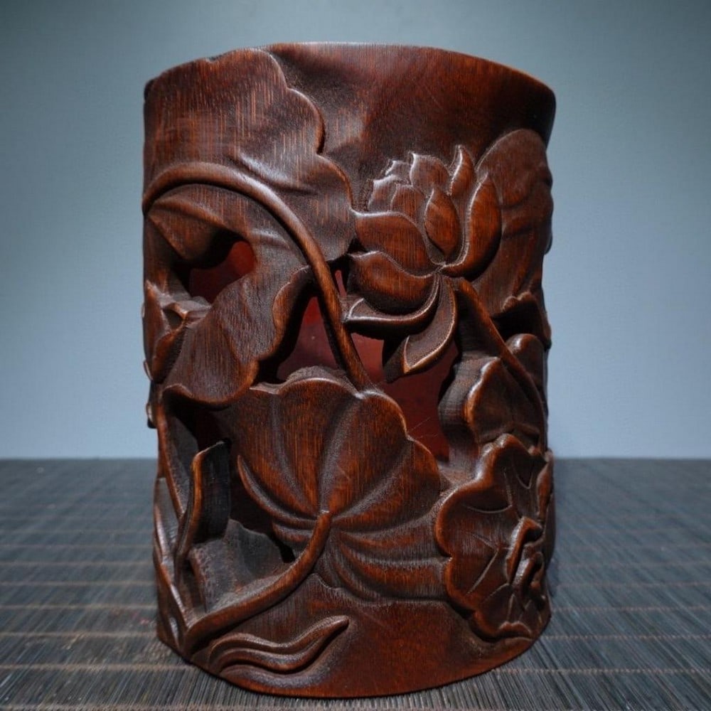 Hand Carved Bamboo Black Lotus Pen Holder: Hand Carved Bamboo Black Lotus Pen Holder This vintage bamboo pen holder is beautifully carved with a delicate lotus design. The natural texture of the bamboo enhances the elegance of the intricate lo