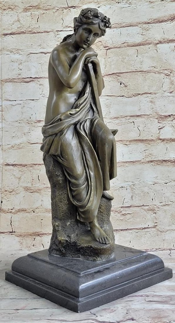 Contemplative Woman Bronze Sculpture by Milo - 16'' x 6.5'': Contemplative Woman Bronze Sculpture by Milo - 16" x 6.5" This enchanting bronze sculpture by Milo captures the serene beauty of a seated woman in a moment of tranquil contemplation. With her 