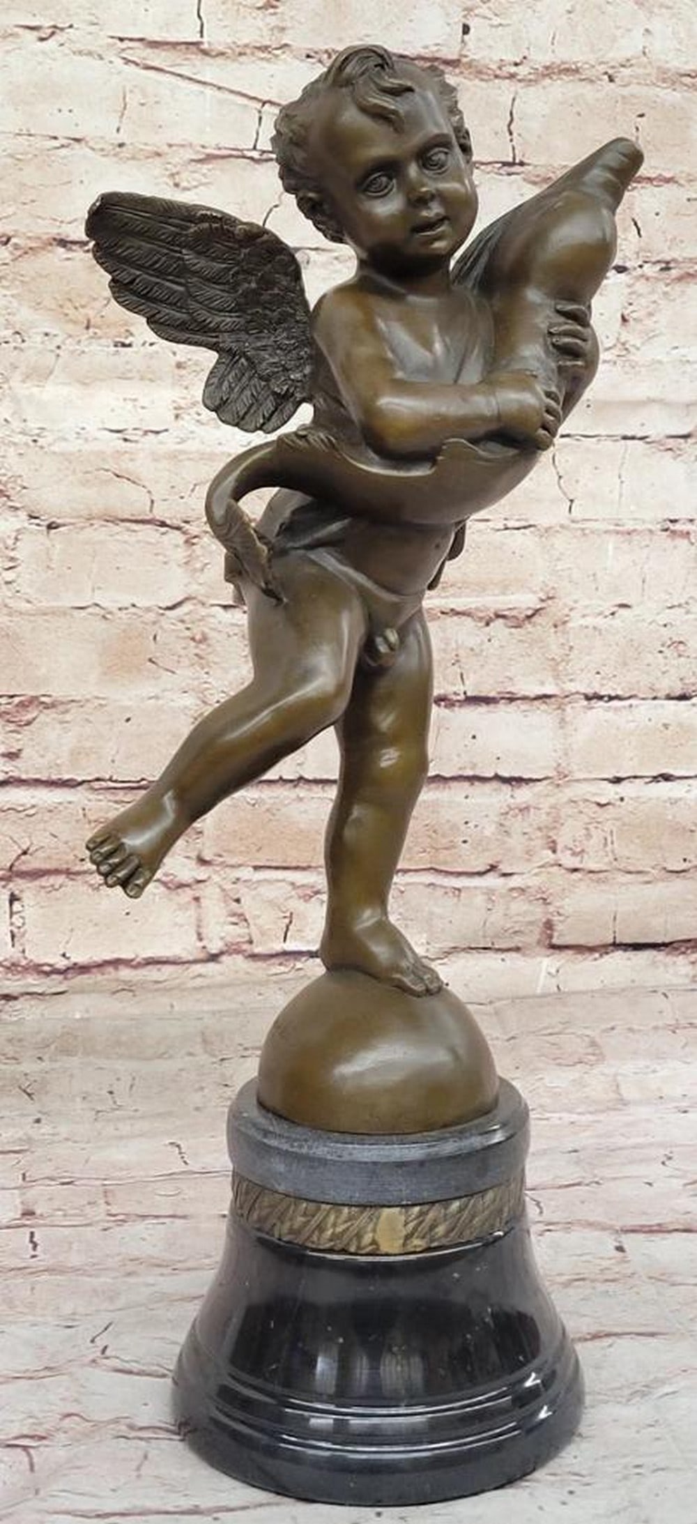 A. del Verrocchio's Original Bronze Sculpture: Cherub Angel Putto with a Dolphin - 16'' x 7'': A. del Verrocchio's Original Bronze Sculpture: Cherub Angel Putto with a Dolphin - 16" x 7" Andrea del Verrocchio, a prominent sculptor of the Renaissance era, played a crucial role bridging t