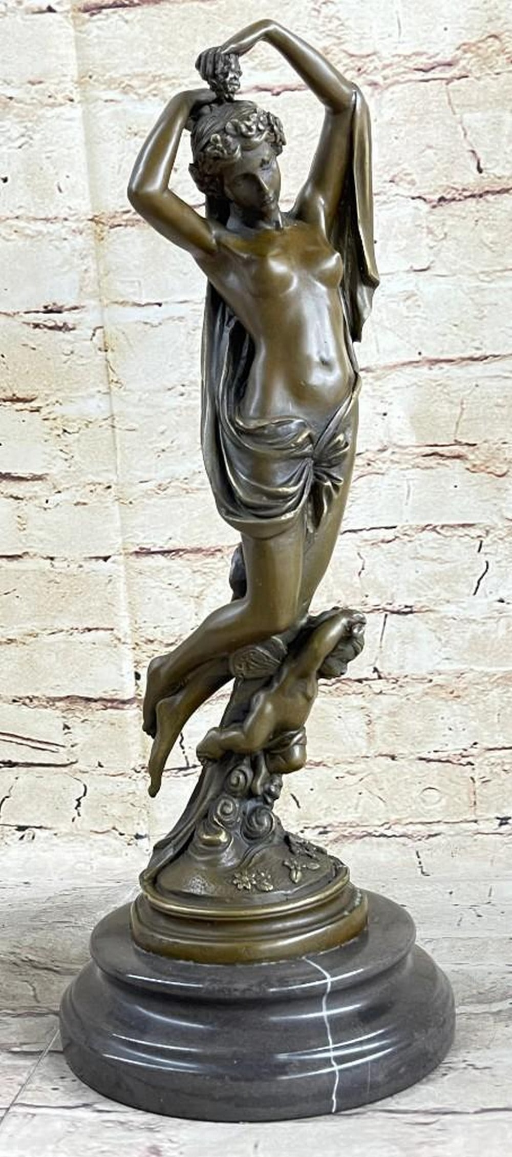 Moreau Inspired Cherub Carrying Graceful Woman Bronze Sculpture - 15'' x 6'': Moreau Inspired Cherub Carrying Graceful Woman Bronze Sculpture - 15" x 6" Embrace the beauty and grace of Hellenistic art with this stunning handmade bronze sculpture. Featuring a beautiful m