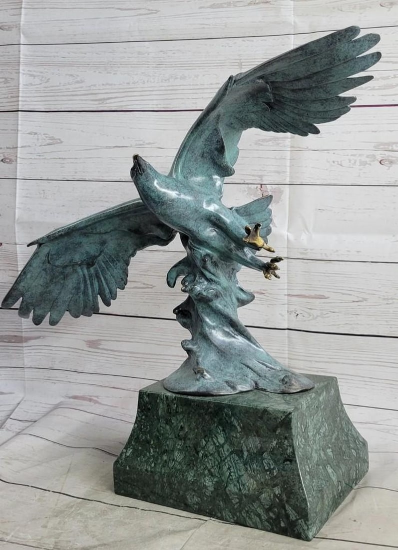 Bald American Eagle Bronze Sculpture: Bald American Eagle Bronze Sculpture A fascinating and eye catching sculpture. A large eagle spreads his wings and prepares for flight. His large wings arch high above him. His talons prepare to relea