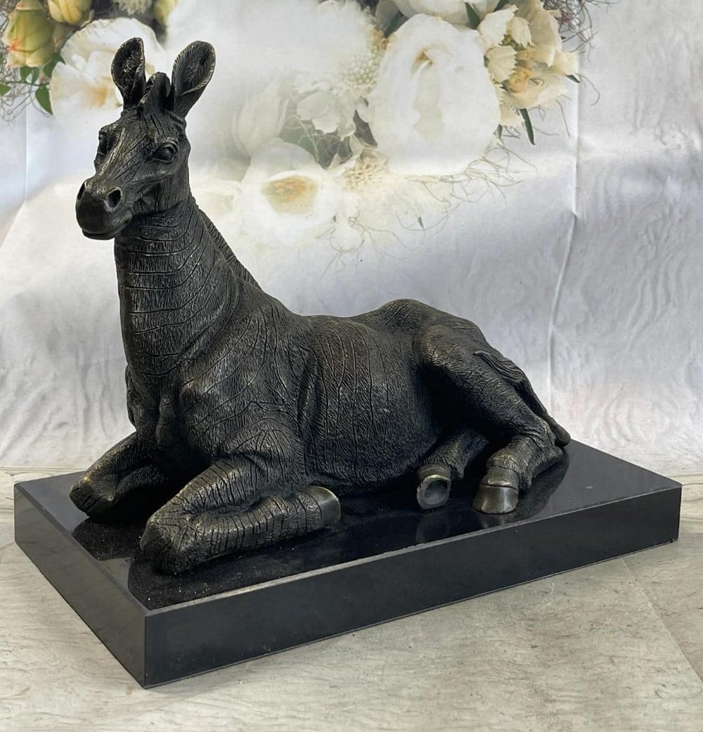 Calm Zebra Bronze Sculpture On Marble Base - 10'' x 13'': Calm Zebra Bronze Sculpture On Marble Base - 10" x 13" This stunning Bronze Zebra Sculpture by artist Milo," showcases the unique nature-inspired style and singular expression of its creat