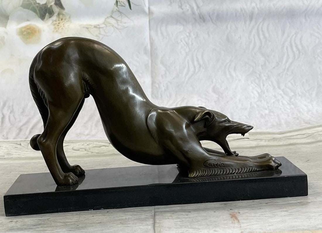 Stretching Grey Hound Inspired Bronze Statue - 6.5'' x 10'': Stretching Grey Hound Inspired Bronze Statue - 6.5" x 10" This elegant bronze statue captures the graceful form of a greyhound mid-stretch. The sculpture highlights the breed's slender build a