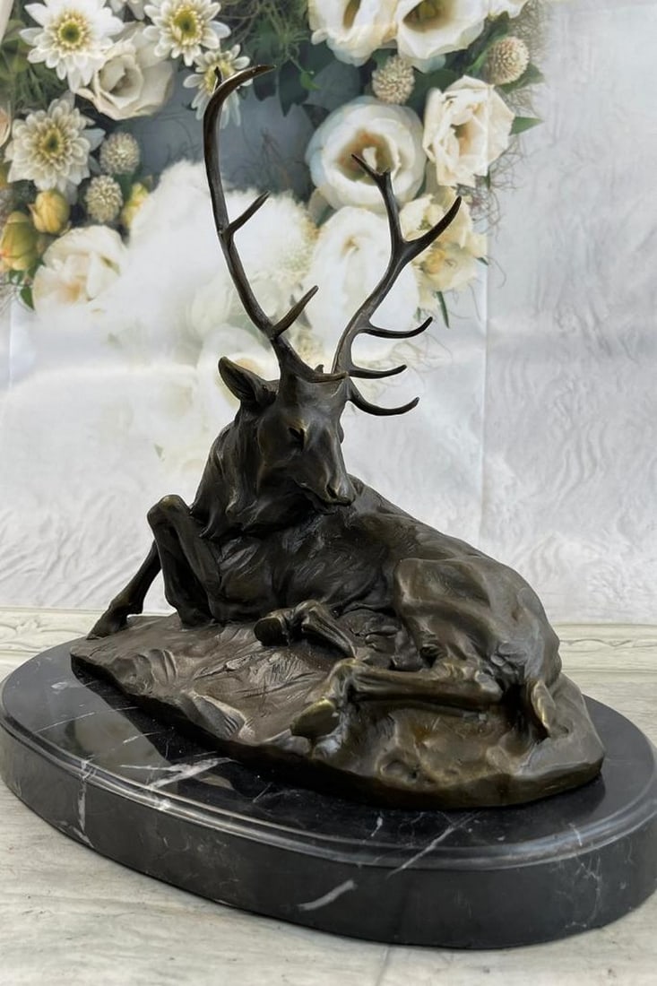 Resting Elk Original Bronze Statue - 11.5'' x 12'': Resting Elk Original Bronze Statue - 11.5" x 12" This exquisite bronze statue captures the serene essence of a majestic elk at rest. The intricate detailing highlights the elk's relaxed postur