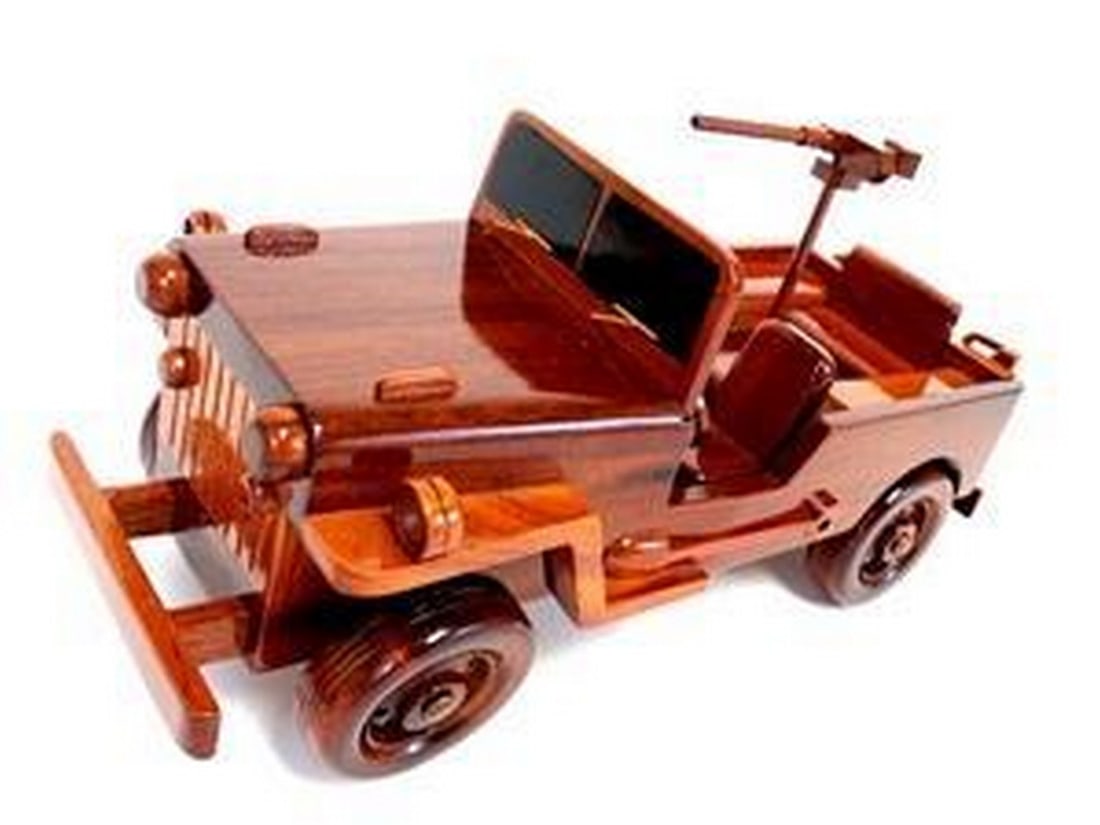 Willy's Military Jeep Wooden Model: Willy s Military Jeep Wooden Model The Willy s Military Jeep is beautifully recreated in this handcrafted scale model. Made of solid mahogany and finely detailed, this classic aircraft in a clear