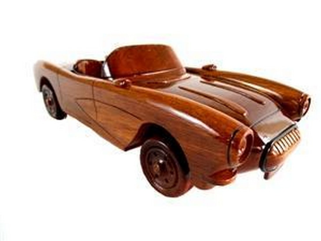1957 Corvette Convertible: 1957 Corvette Convertible This scale model replica of the 57 Corvette Convertible makes a great gift for the classic car enthusiast. Hand crafted from solid mahogany, this model is exceptionally