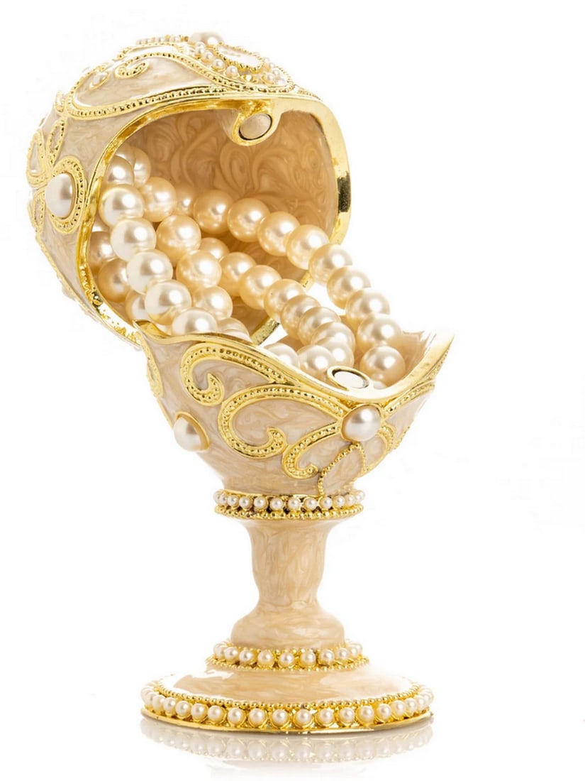 Golden Easter Egg Pearl Trinket Box: Golden Easter Egg Pearl Trinket Box This enamel trinket box, hand-painted and adorned with Austrian crystals, is finished with 24K gold plating and features a secure magnetic closure. Each crystal is