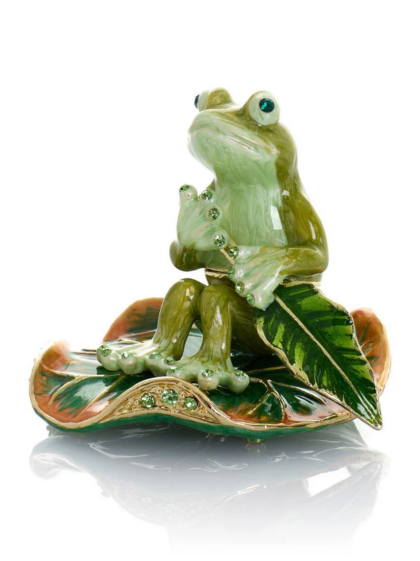 Frog Rowing Leaf Enamel Trinket Box: Frog Rowing Leaf Enamel Trinket Box This enamel trinket box, hand-painted and adorned with Austrian crystals, is finished with 24K gold plating and features a secure magnetic closure. Each crystal is