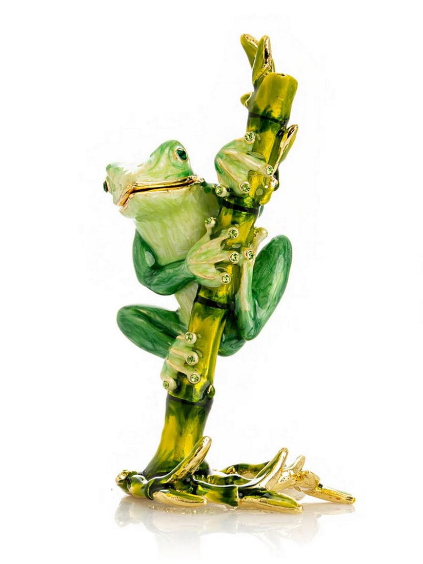 Emerald Frog on Bamboo Enamel Trinket Box: Emerald Frog on Bamboo Enamel Trinket Box This enamel trinket box, hand-painted and adorned with Austrian crystals, is finished with 24K gold plating and features a secure magnetic closure. Each cryst